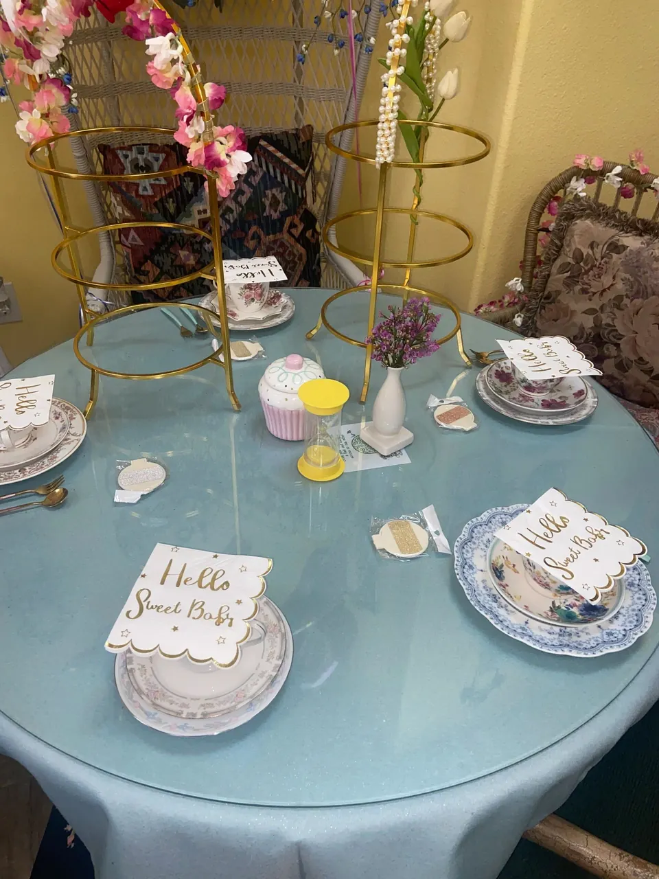 Baby shower tea table set with floral china and pastel decorations
