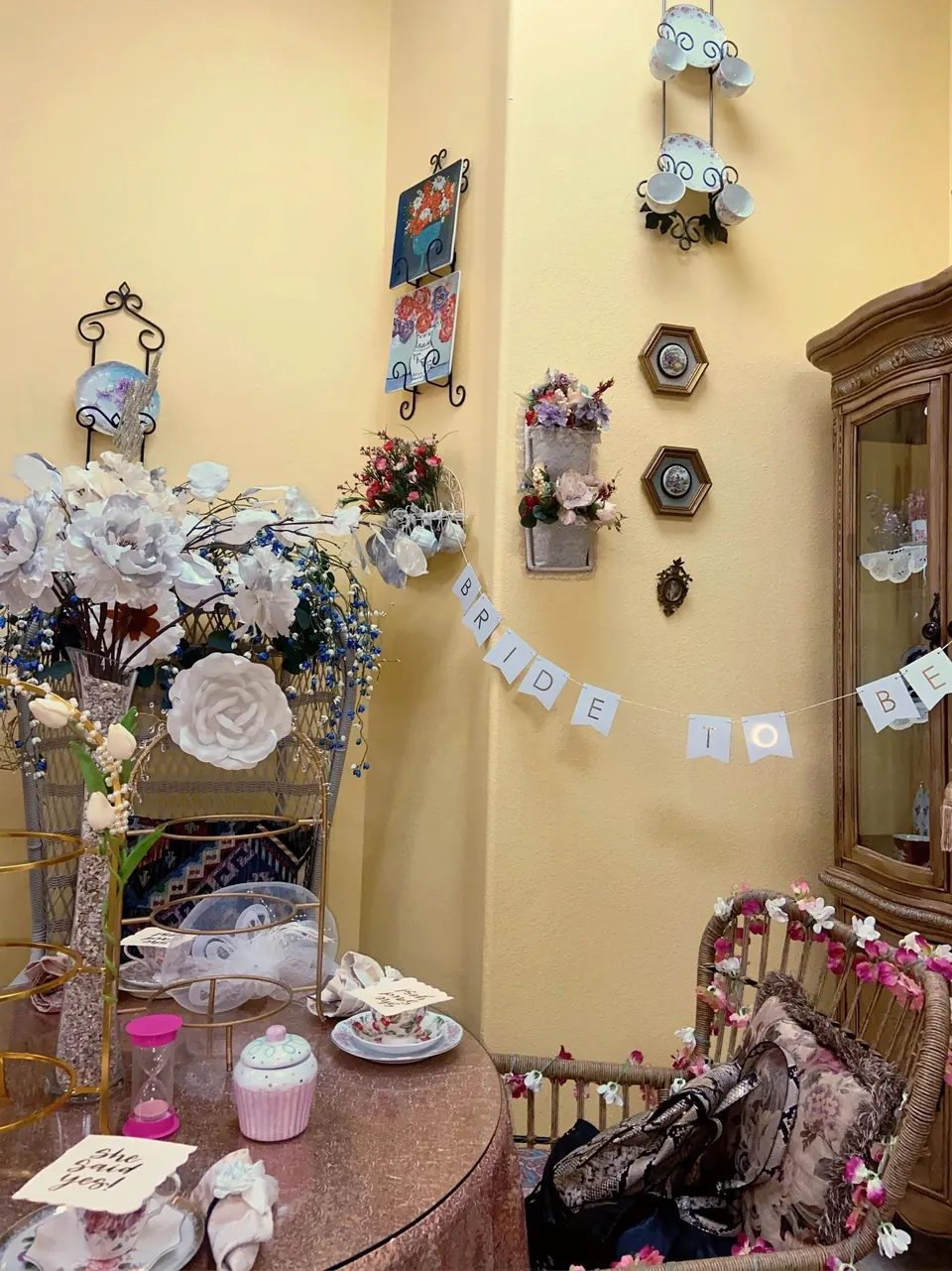 Decorated celebration table beneath The Tea Terrace china wall