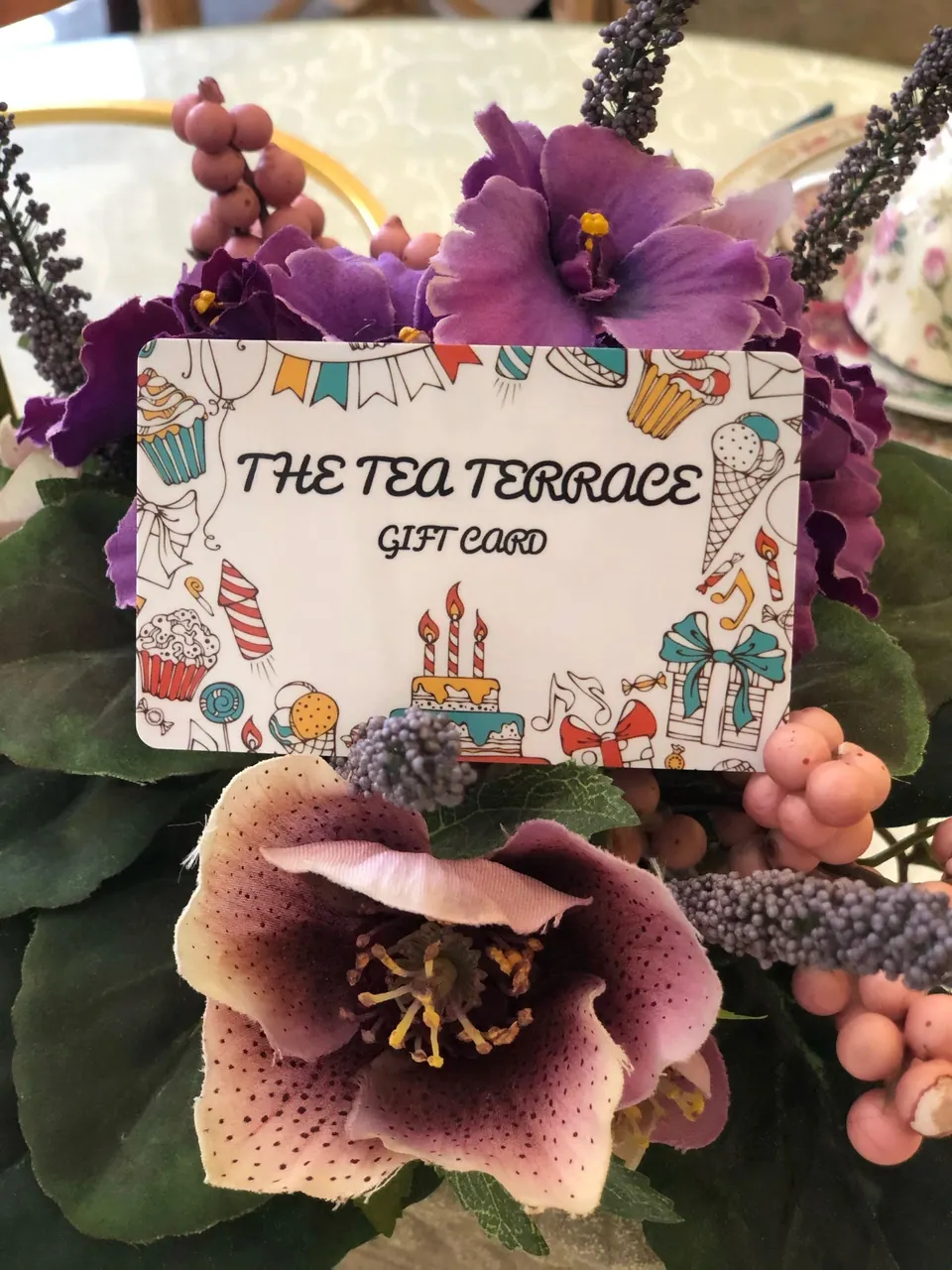 The Tea Terrace gift card displayed among flowers