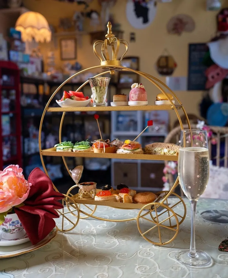 King's Afternoon Tea served on a gold carriage stand